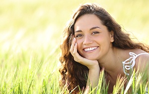 Woman with beautiful smile thanks to cosmetic dentistry