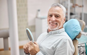 smiling man in the dental chair