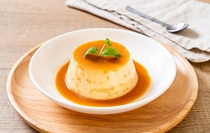 a bowl with flan for dental implant diet