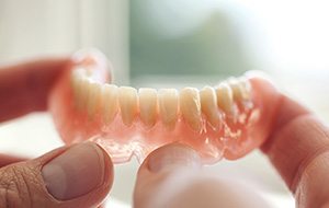 A closeup of a lower denture