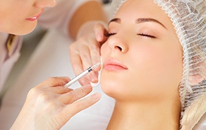 Woman receive a BOTOX® injection