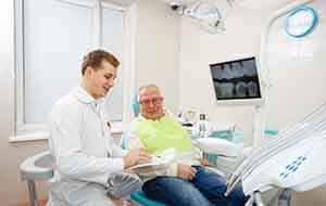 Man smiling at the dentist