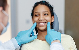 Teenager smiling after getting dental sealants