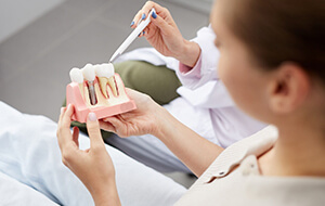 Dentist and patient discussing cost of dental implants Jacksonville