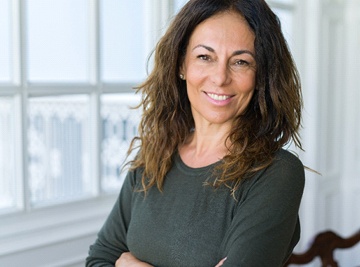 A middle-aged woman smiling