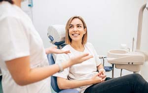 woman listening to her dentist