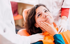 Woman visiting Jacksonville emergency dentist for care