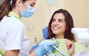 Woman smiling at emergency dentist in Jacksonville