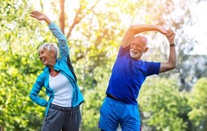 senior man and woman doing stretches