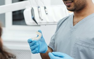 Woman counting cash for Invisalign