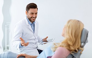 Dentist and patient having conversation