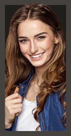 Smiling woman wearing dark blue jacket