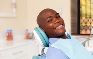 Smiling man in dental chair