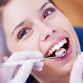 woman receiving dental checkup