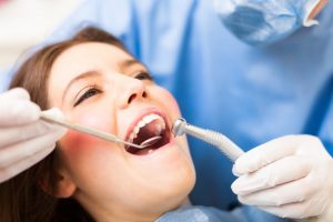 A woman having her dental exam.