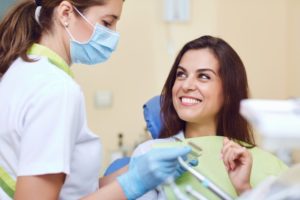 Happy patient talking with Jacksonville dentist during cosmetic consultation